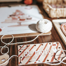 Load image into Gallery viewer, Valentine's Day card with 'BE MINE' text on a wooden surface